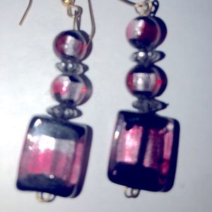 Black and maroon fish hook earring. Never worn.